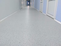 Decorative coating with colored acrylic flocks, corridors of a pharmaceutical company